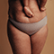 Woman's body post-pregnancy wearing only underwear