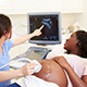 A woman receives an ultrashound.