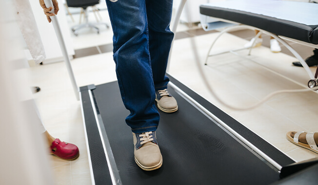 Person walking on a treadmill. 