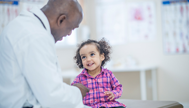 doctor talks with child