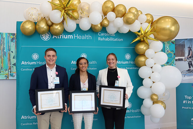 CR Residents stand for a group photo with their degrees.