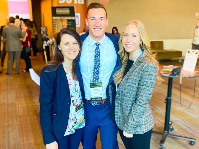 Three people at conference