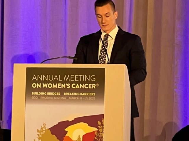 Person presenting at conference