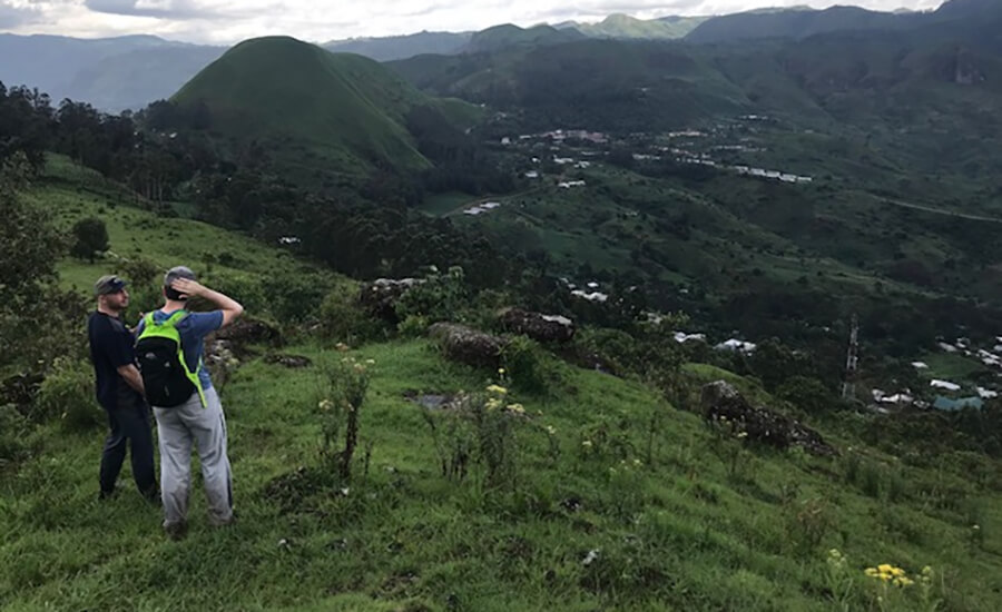 Two hikers on a mountain.