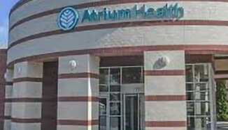 the front door and business signage for Atrium Health Behavioral Health Charlotte.