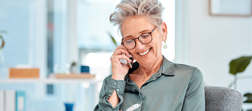 Person speaking on a phone.
