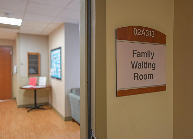 The entrance to the waiting room adorned with a sign reading: "Family Waiting Room."