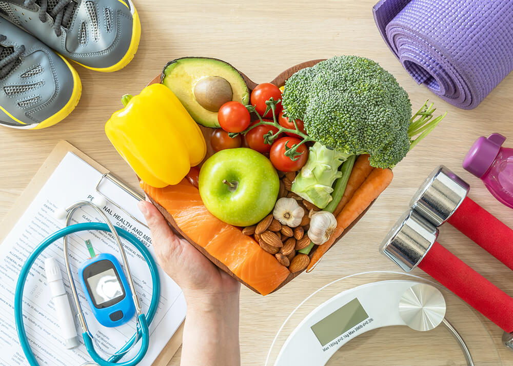 A plate of various vegetables rests in a person's hand.