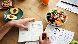 Writing in food journal.