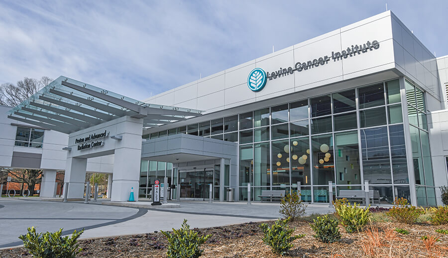 The exterior of a medical office building with a sign that reads "Levine Cancer Institute".
