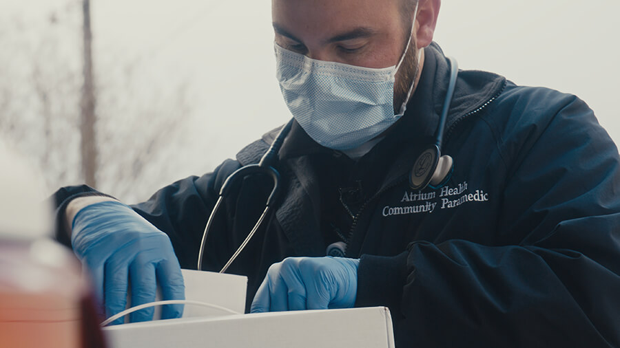 A medical professional looking through medical equipment.