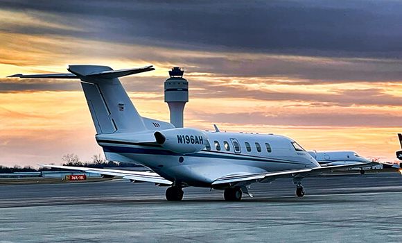 Pilatus Med Center Airplane on ground with sunset in background