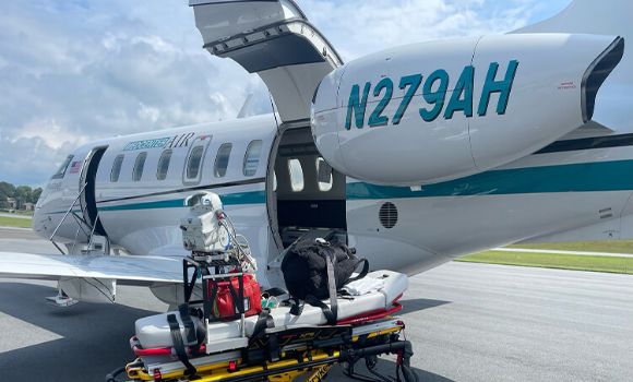 Medical equipment and stretcher in front of Pilatus Med Center Air Airplane