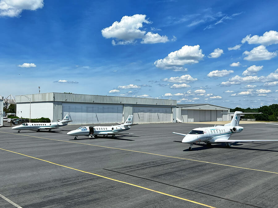 Three Pilatus PC-24 Med Center Airplanes ouside