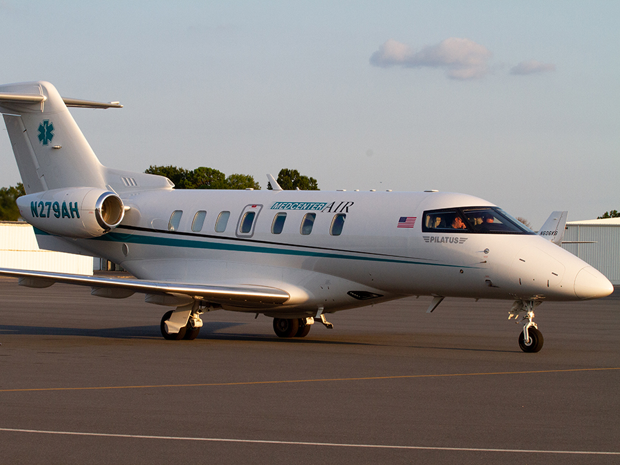 A side view of a fixed-wing plane.