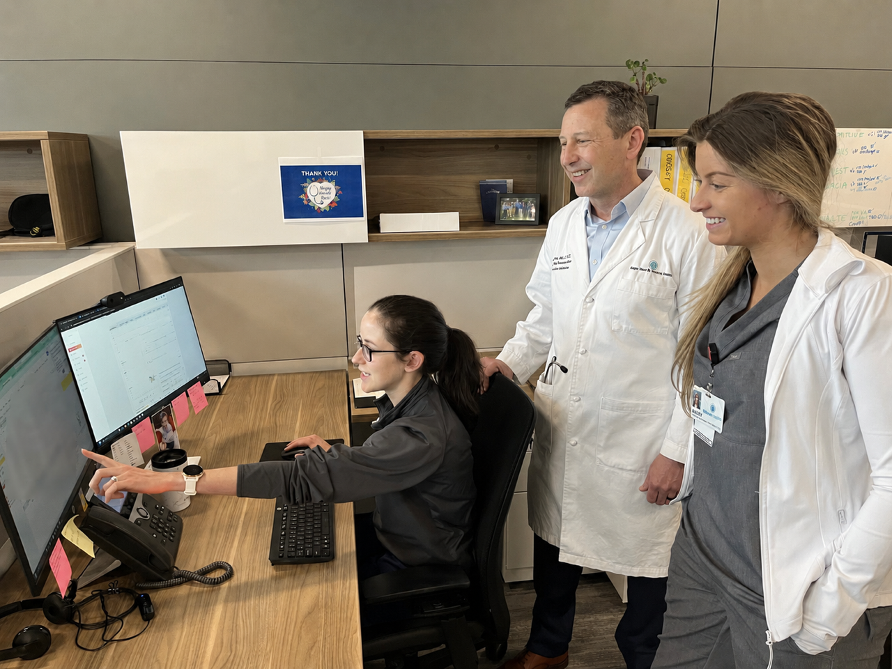 Dr. Bill Downey (center) connects with members of the cardiovascular analytics team at Atrium Health Sanger Heart & Vascular Institute.