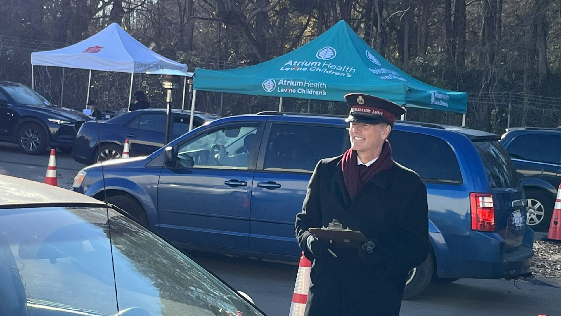 Salvation Army member handing out hygiene box