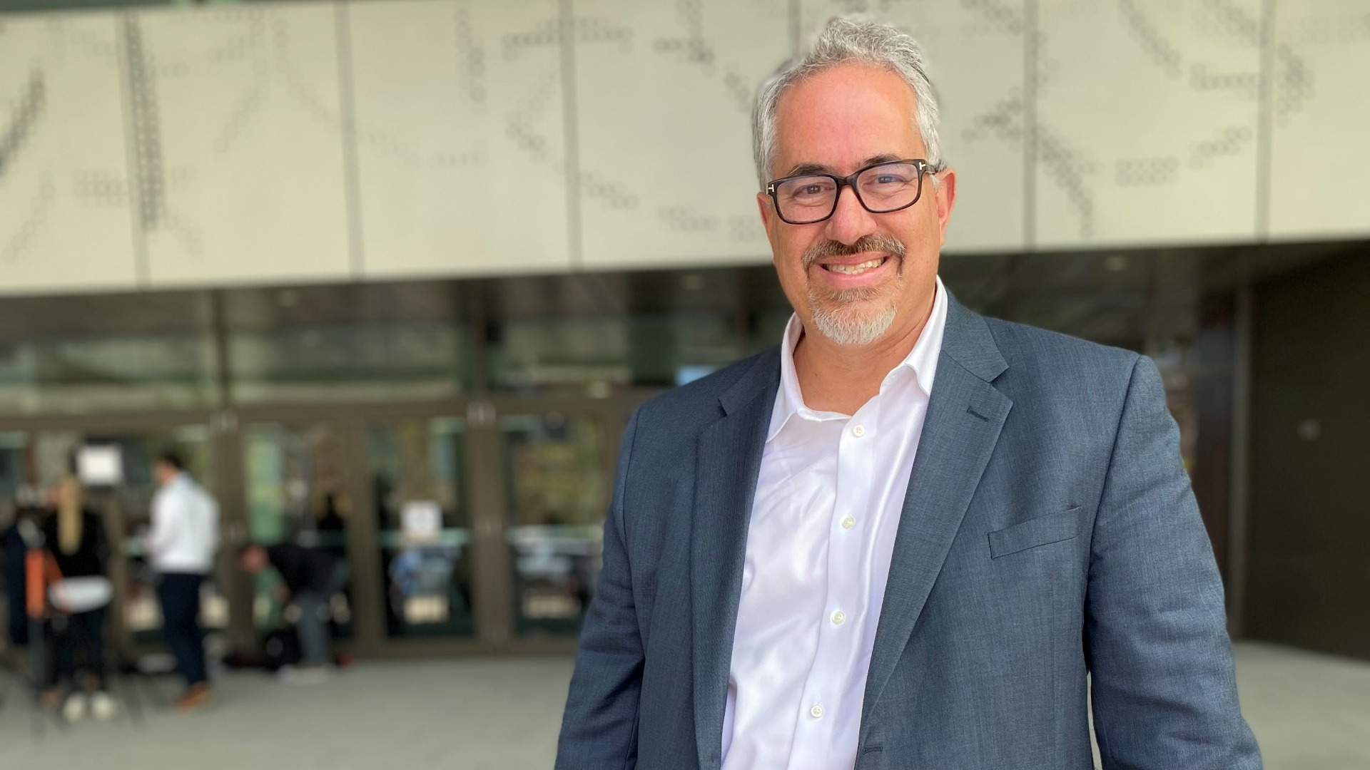 Dr. Ruben A. Mesa standing outside a building