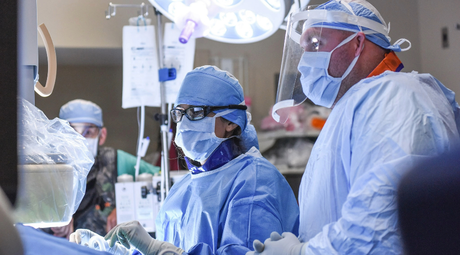 Surgeons working on a patient.