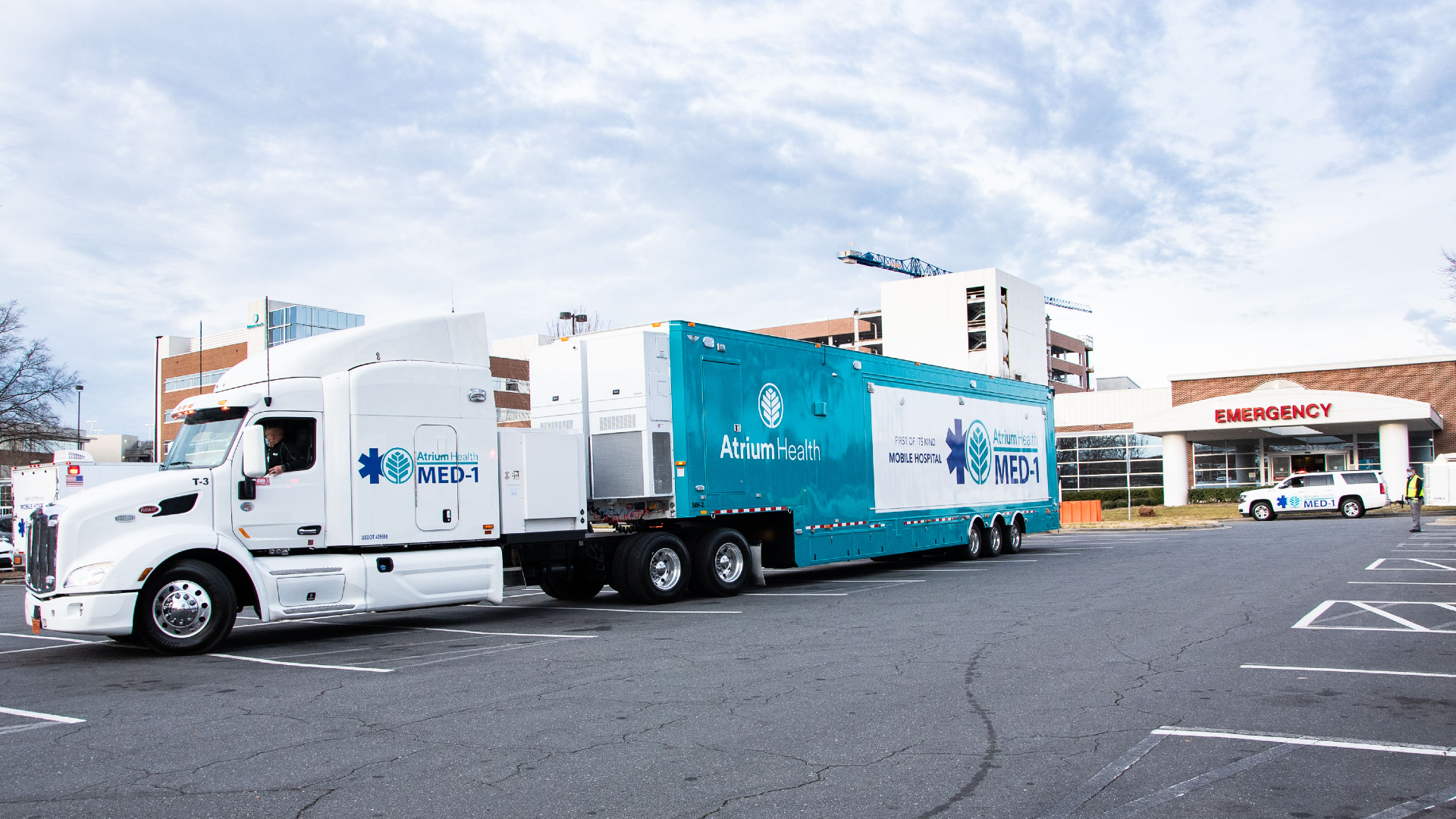 The newest Atrium Health MED-1 mobile hospital will be deployed to Atrium Health Pineville to help with emergency department services. The state-of-the-art emergency department on wheels will be used to help treat less critical patients, providing added bed space during a time when hospitalizations continue to rise due to COVID-19 in the Charlotte area and around the country. 