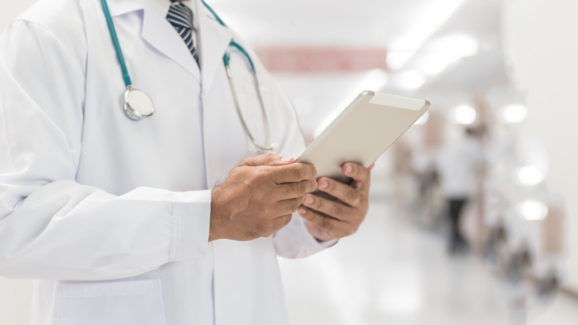 Image of a physician viewing medical records. 