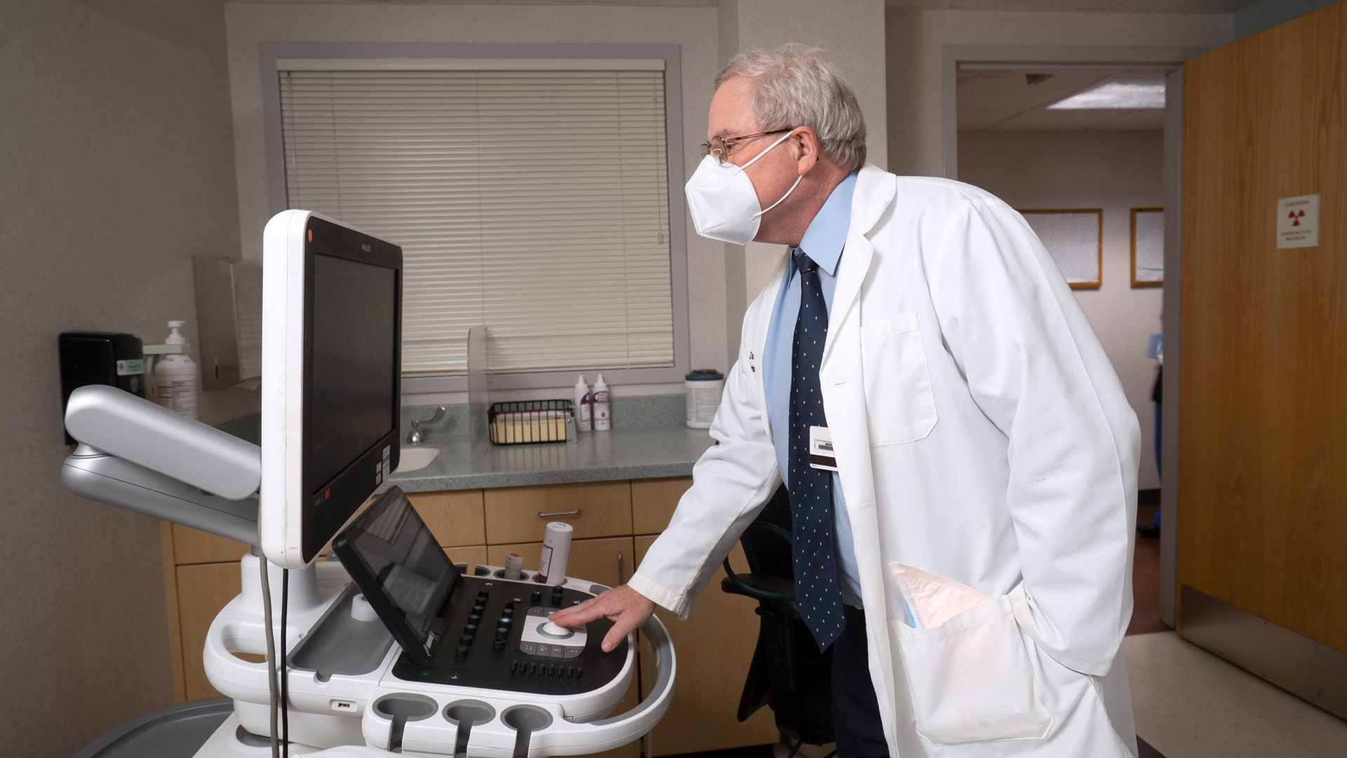Dr. Dalane W. Kitzman looking at information on a computer