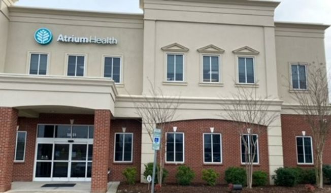 Exterior view from parking lot of Atrium Health Musculoskeletal Institute Orthopedics & Sports Medicine.