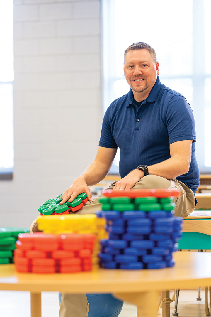 Brandon Scott with children toys.