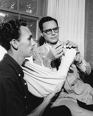 Jesse H. Meredith, MD, performed the nation's first hand re-implantation surgery.