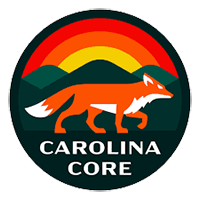 A round logo with a rainbow at the top, a fox in the middle and "Carolina Core" at the bottom.