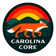 A round logo with a rainbow at the top, a fox in the middle and "Carolina Core" at the bottom.
