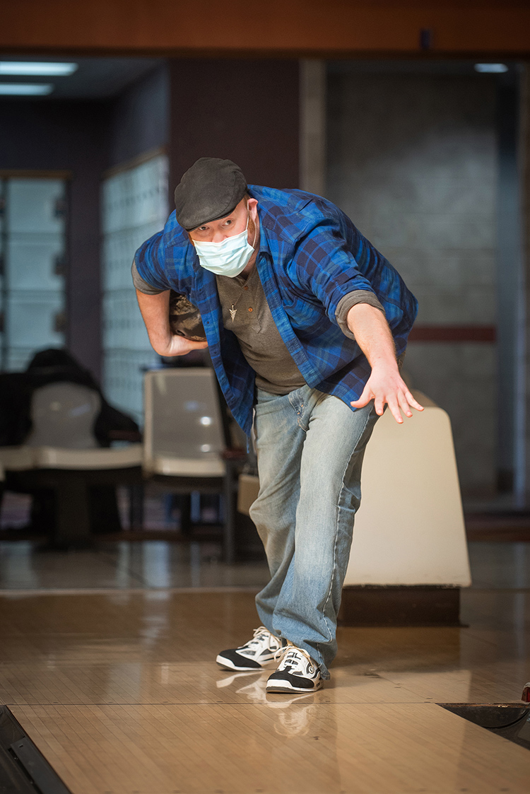 Adam Reade in a bowling stance.