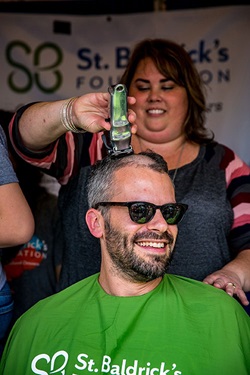 Dr. Kram shaving his head for St. Baldricks