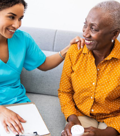 Female patient talking to an oncology navigator. 