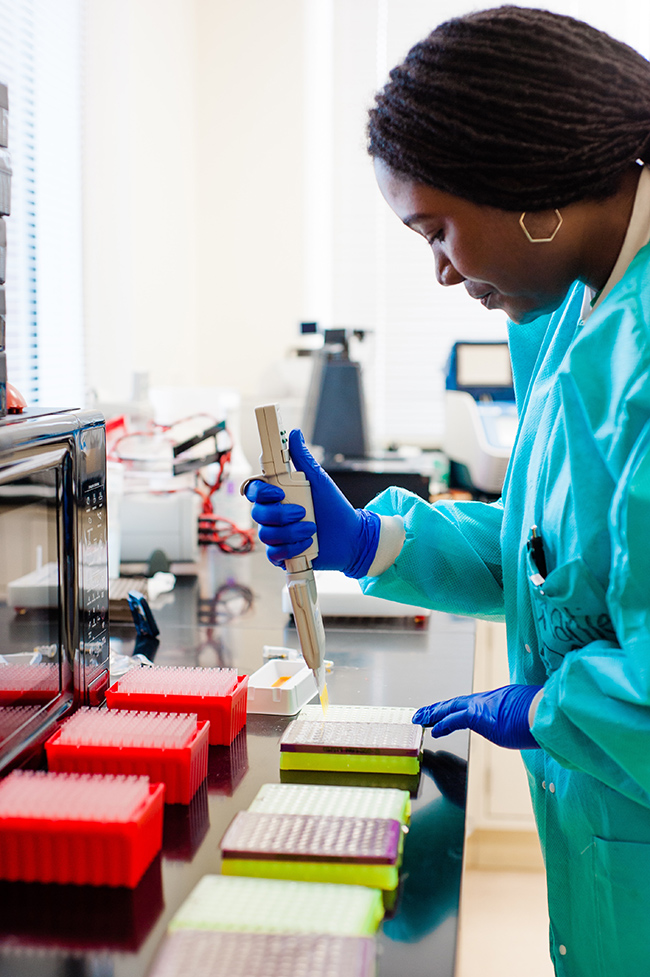 Female lab tech completing tests. 