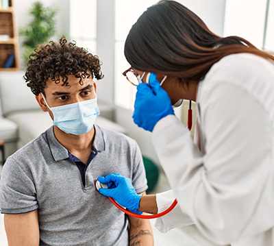 Young man being examined by female doctor