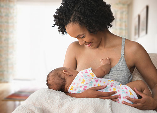 Mom breastfeeding her infant. 