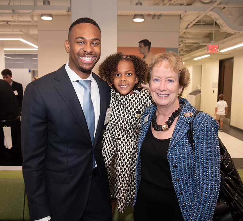 Cameron Webb, MD '13, JD, his daughter Avery Webb and Julie Freischlag, MD