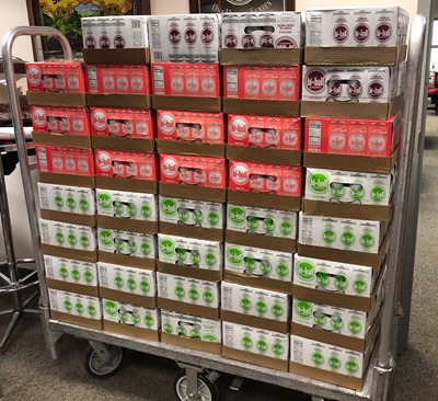 A cart full of cases of Hi-Ball Beverage, in a variety of flavors