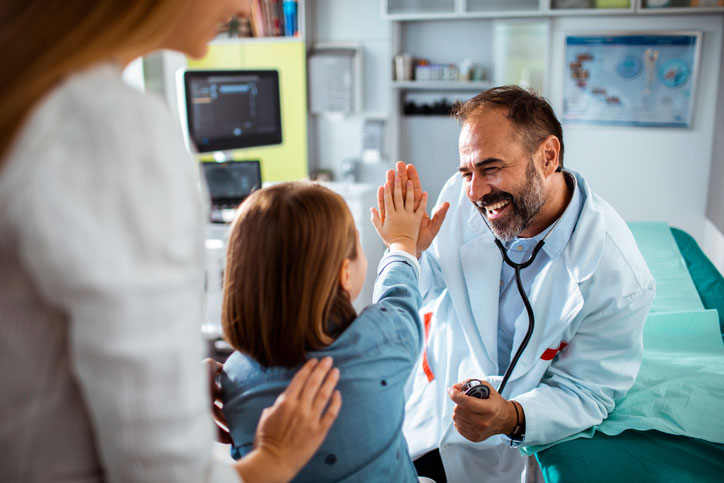 Provider giving a high five to a patient