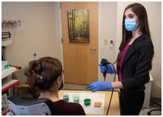 Performing a FEES exam with pt. 