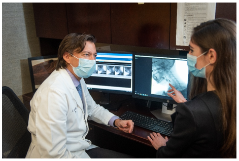 Providers discussing a FEES/MBS exam result.