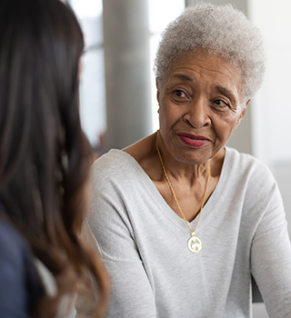 Young doctor with elderly patient
