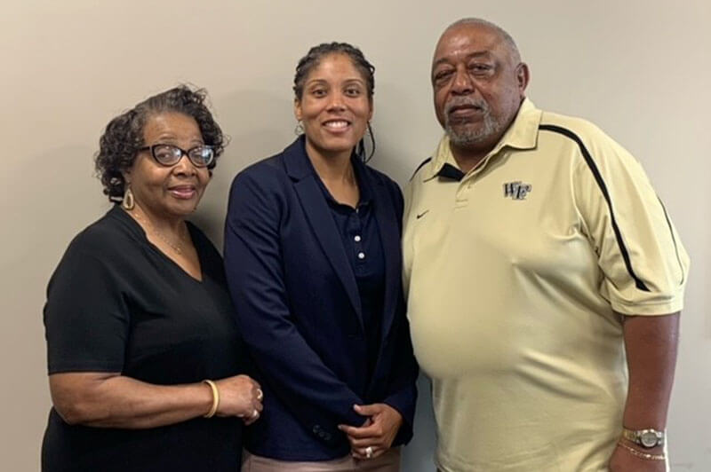 Ercell and Linda Tate standing next to a recipient of their namesake scholarship the Tate Scholarship.