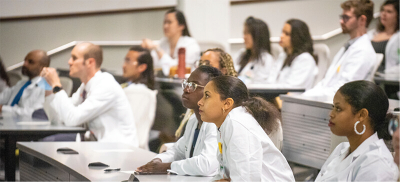 A group of medical students sitting in class.