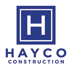  A logo with blue text and a blue box with a white "H" in the middle of it representing Hayco Construction.