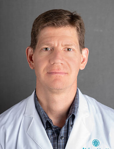 John E. Barkenbus, MD