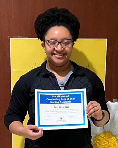 Erin Howard holding BEE award.