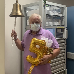 Earl Groce, 72, rings the bell to celebrate his five year survival of stage IV pancreatic cancer at the Comprehensive Cancer Center at Wake Forest Baptist Medical Center. The celebration also marked his 116th chemotherapy treatment.