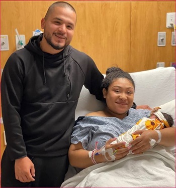 Angelita Garcia-Cruz, and father, Jose Mendez holding baby Mia.
